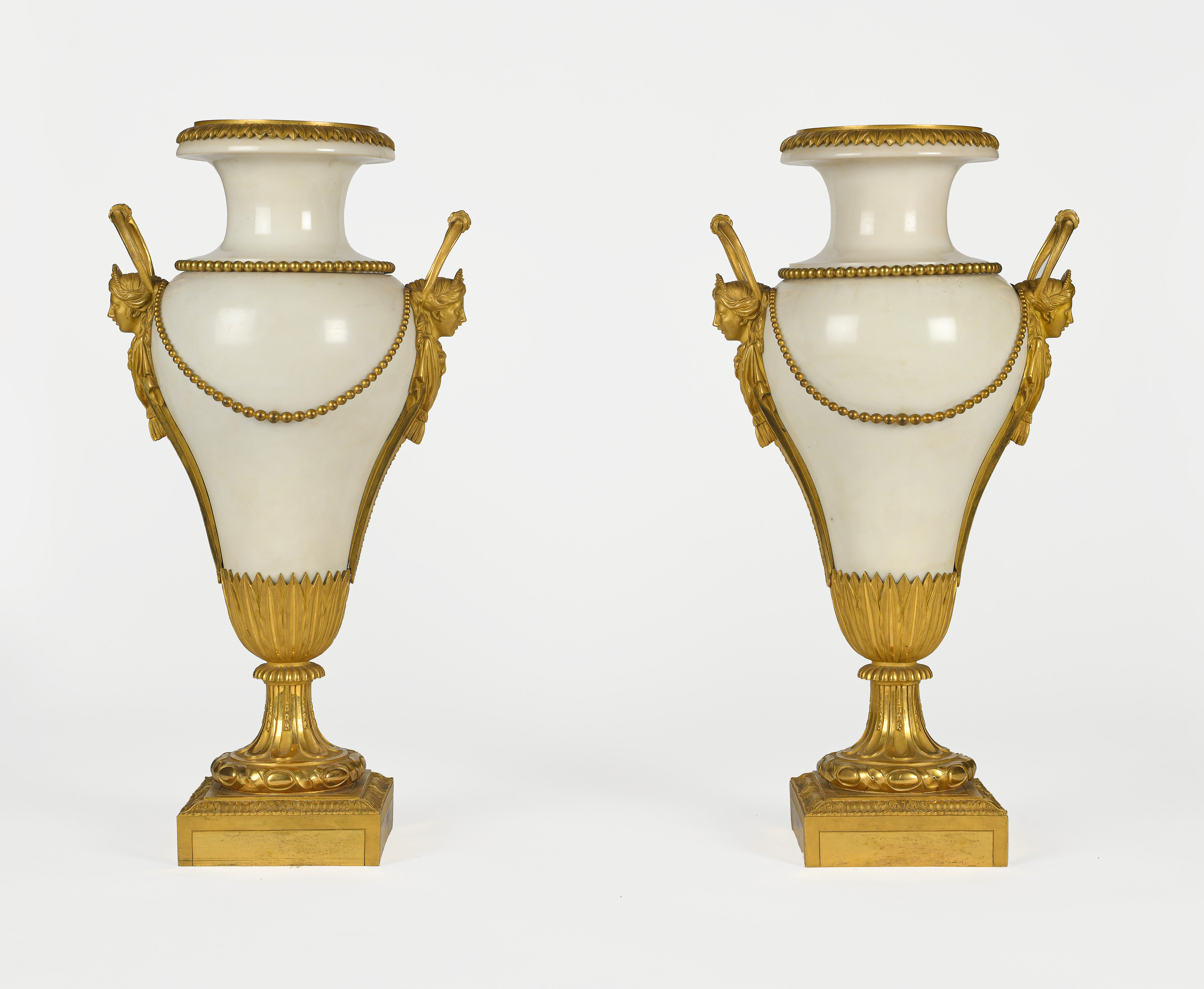 A pair of Restauration ormolu and white marble vases